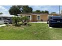 Well-maintained lawn and landscaping enhance the curb appeal of this home at 2120 W Virginia Ave, Tampa, FL 33607