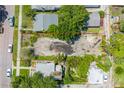 Aerial view of an empty, overgrown lot, bordered in red and ready for building at 2910 11Th N St, St Petersburg, FL 33704