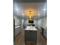 Updated open concept kitchen with a large island and granite countertops at 3505 Medulla Rd, Plant City, FL 33566