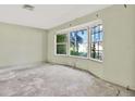 Spacious living room with a bay window, offering natural light and scenic views at 4173 85Th N St, St Petersburg, FL 33709