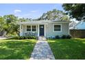 Charming single-story home with a well-manicured lawn and inviting front porch at 4637 4Th N Ave, St Petersburg, FL 33713
