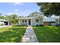 Charming single-story home with a well-manicured lawn and inviting front porch at 4637 4Th N Ave, St Petersburg, FL 33713