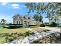 Charming single-Gathering home with front porch, a lush lawn, and attached garage at 5205 Brighton Shore Dr, Apollo Beach, FL 33572