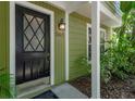 Close-up of the front door showcasing the address and design details at 945 Hamilton Ct, Palm Harbor, FL 34683
