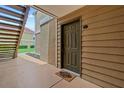 View of front door entrance with welcome mat and unit number 212 at 9481 Highland Oak Dr # 212, Tampa, FL 33647