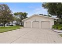 Charming home featuring a three-car garage and a well-maintained lawn at 10053 W Bay St, Seminole, FL 33776
