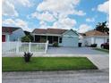 Inviting single-story home with a manicured lawn and a welcoming facade at 1918 Crown Park Dr, Valrico, FL 33594