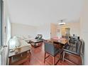 Bright living room with hardwood floors, comfortable seating, and natural light at 1921 58Th N Ave # 15, St Petersburg, FL 33714