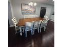 Formal dining area with hardwood floors, an extending wooden table, and seating for six, perfect for Gathering gatherings at 302 W Fern St, Tampa, FL 33604
