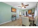 Bright dining room with tiled floors, neutral paint, and a table set for six creating an inviting atmosphere at 317 Elizabeth Ave, Clearwater, FL 33759