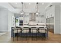 Gorgeous kitchen featuring a center island with seating, stainless steel appliances, and pendant lighting at 4109 W Inman Ave, Tampa, FL 33609