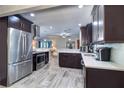 Modern kitchen featuring stainless steel appliances, stylish cabinets, and an open layout at 8289 136Th St, Seminole, FL 33776