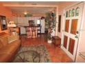 Cozy living room features an open floor plan, comfortable seating, and access to the kitchen at 100 94Th Ave, Treasure Island, FL 33706