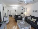 Inviting living room featuring neutral furniture, decorative nautical accents, and ample natural light at 1250 S Pinellas Ave # 1013, Tarpon Springs, FL 34689