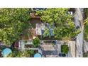 Aerial view of the property with a backyard and surrounding neighborhood with mature trees at 1513 W Mohawk Ave, Tampa, FL 33603