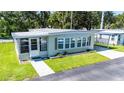 Well-kept single-story home featuring a neatly landscaped yard and a covered carport at 37812 Valencia Ave, Zephyrhills, FL 33541