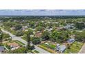 A serene residential neighborhood is surrounded by lush greenery and mature trees at 4242 7Th N Ave, St Petersburg, FL 33713