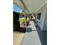 Welcoming covered front porch with seating, perfect for enjoying the outdoors at 5215 76Th N N St, St Petersburg, FL 33709