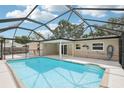 Inviting screened-in pool with ample deck space for relaxing and entertaining; ideal for enjoying the outdoors at 6220 Murdock Ave, Sarasota, FL 34231