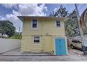 Exterior view of building with a yellow color scheme and access to off street parking at 659 26Th S Ave, St Petersburg, FL 33705