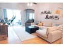 Bright living room with a sliding door, comfortable seating, and modern decor at 6804 Pleasant Oaks Pl, Riverview, FL 33578