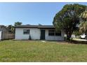 Charming home featuring a well-maintained lawn and inviting curb appeal at 740 7Th Sw Ave, Largo, FL 33770