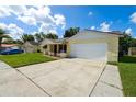 Inviting one-story home with a spacious driveway and a two-car garage at 8720 Briar Patch Dr, Port Richey, FL 34668