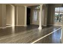 Bright living room with natural light, tile flooring, and elegant architectural details at 1008 Arista Blvd, Valrico, FL 33594
