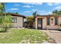 Lovely single-story home with a well-manicured lawn and decorative landscaping at 10549 112Th Ave, Largo, FL 33773