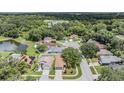 Aerial view of homes in a wooded area with lakes at 11022 Connacht Way, Tampa, FL 33610