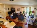 Spacious living room with hardwood floors, comfortable seating, and natural light at 1620 58Th N Ave # 6, St Petersburg, FL 33712