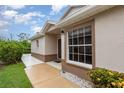 Inviting front entrance with well manicured lawn and mature shrubbery for eye-catching curb appeal at 1626 Terra Ceia Bay Cir # 6, Palmetto, FL 34221