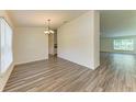 A bright dining room with modern floors, a chandelier, and plenty of natural light at 3682 Johnstown St, North Port, FL 34288