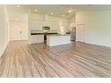 Open-concept kitchen featuring granite countertops and modern stainless steel appliances at 3682 Johnstown St, North Port, FL 34288