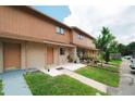 Inviting two-story townhome with a well-kept lawn and sidewalk at 4008 Pine Limb Ct, Tampa, FL 33614