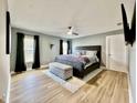 Serene main bedroom featuring a ceiling fan, hardwood floors, and ample natural light at 4029 9Th S Ave, St Petersburg, FL 33711