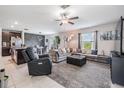 Spacious living room featuring comfortable seating, a ceiling fan, and abundant natural light at 5522 Appleton Shore Dr, Apollo Beach, FL 33572