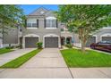 A charming townhouse featuring a well-manicured lawn and neat landscaping at 10208 Westpark Preserve Blvd, Tampa, FL 33625