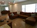Cozy living room featuring a large comfortable sectional sofa and lots of natural light at 2239 Curtis S Dr, Clearwater, FL 33764