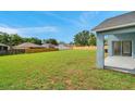 Expansive backyard offers a private retreat, surrounded by a tall wooden fence at 243 Chardonnay Pl, Valrico, FL 33594