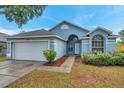 Charming single-story home features a two-car garage and well-maintained landscaping at 243 Chardonnay Pl, Valrico, FL 33594