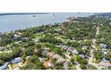 Beautiful aerial view of a residential area, showcasing lush greenery and proximity to the waterfront at 245 Grove Cir N, Dunedin, FL 34698