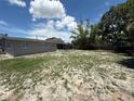 Spacious backyard view with a screened-in patio, perfect for entertaining and relaxing at 2907 W Elrod Ave, Tampa, FL 33611