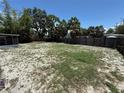 Large, fenced backyard offers plenty of space for outdoor activities at 2907 W Elrod Ave, Tampa, FL 33611