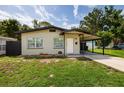 Cozy single-story home with a convenient covered carport and well-kept lawn at 5519 Kelly N Dr, St Petersburg, FL 33703