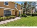 Charming home with well-maintained lawn and landscaping around the entrance at 7001 Interbay Blvd # 203, Tampa, FL 33616
