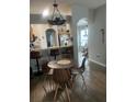 A dining area connects to an open kitchen bar, offering seamless entertaining space at 7719 Carriage Pointe Dr, Gibsonton, FL 33534