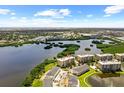 A stunning aerial view showcases the home's location on a scenic lake with lush surroundings at 10002 Key Haven Rd # 503, Seminole, FL 33777