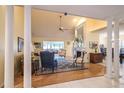 Spacious living room with high ceilings, fireplace, and ample natural light at 11501 Cerca Del Rio Pl, Temple Terrace, FL 33617