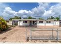 Beautiful single story home with modern updates, a paver parking area, and fenced yard at 1328 Waikiki Way, Tampa, FL 33619